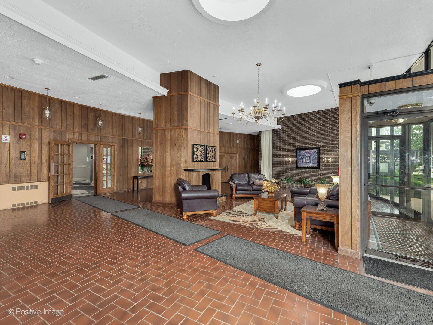 40 North Tower Road, Unit 12F Oak Brook, IL 60523 - Photo 2 of 25 a lobby with furniture and a chandelier
