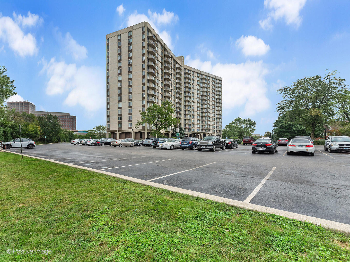 40 North Tower Road, Unit 12F Oak Brook, IL 60523 - Photo 25 of 25 a building with trees in front of it