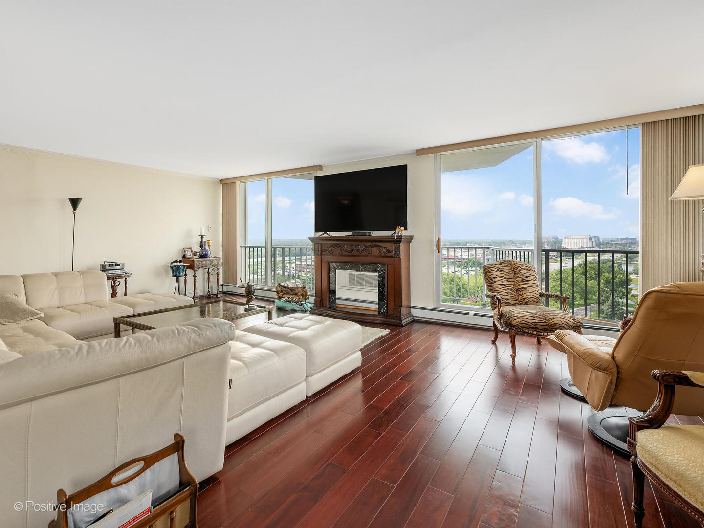 40 North Tower Road, Unit 12F Oak Brook, IL 60523 - Photo 6 of 25 a living room with furniture fireplace and flat screen tv