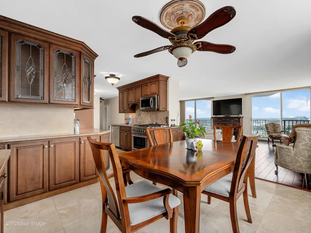 a view of a dining room with furniture and window