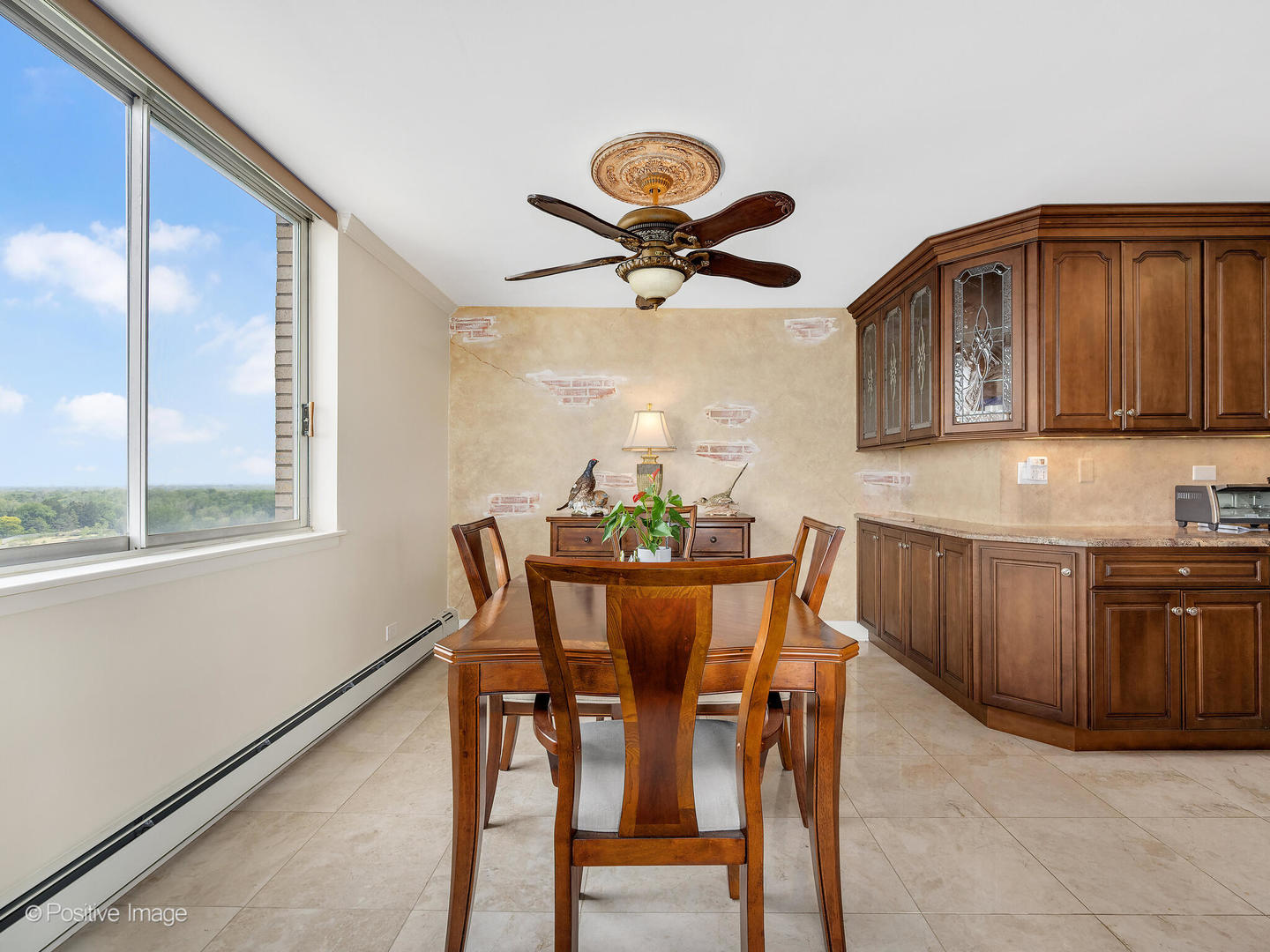 40 North Tower Road, Unit 12F Oak Brook, IL 60523 - Photo 8 of 25 a view of a dining room with furniture and window