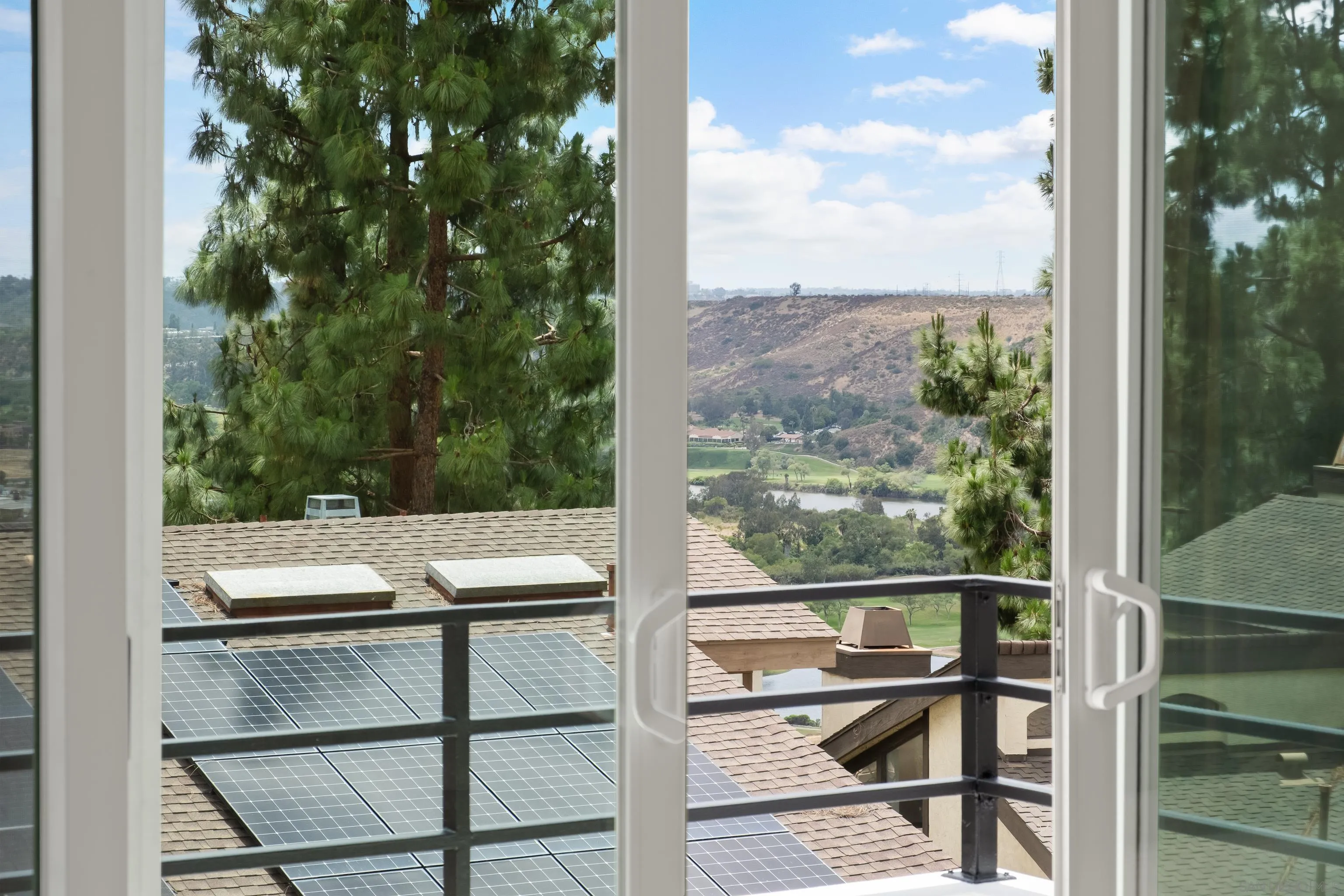 11478 Madera Rosa Way San Diego, CA 92124 - Photo 31 of 54 a view of a balcony with a table and chairs