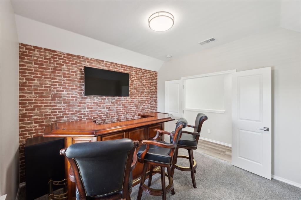 1122 Alicia Lane Lancaster, TX 75134 - Photo 20 of 37 a living room with furniture and a flat screen tv