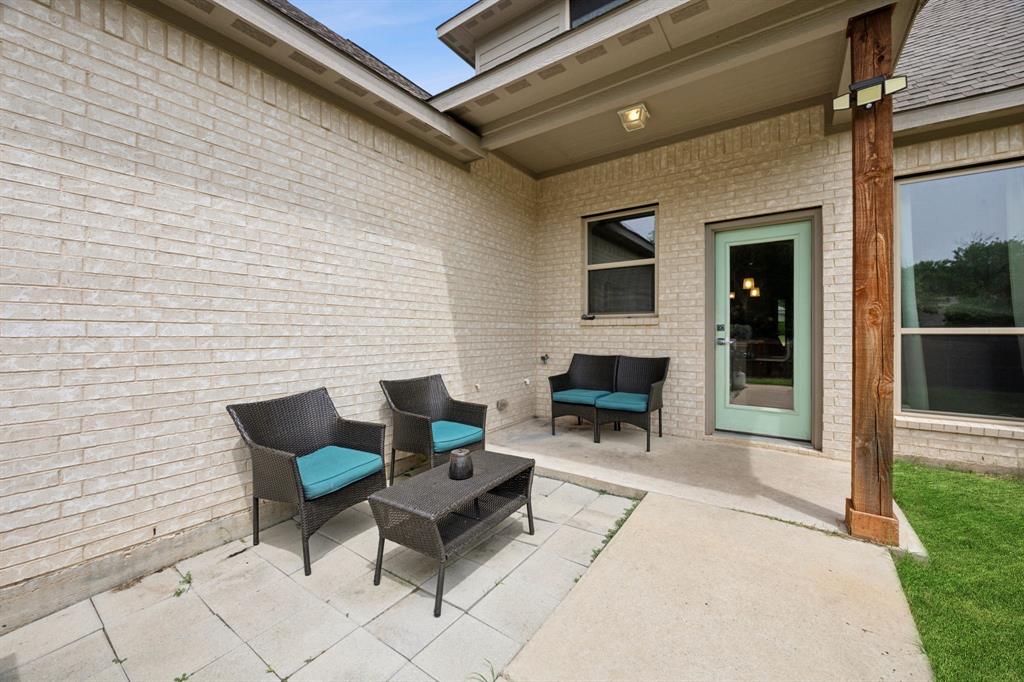 1122 Alicia Lane Lancaster, TX 75134 - Photo 22 of 37 a building outdoor space with patio furniture and fireplace