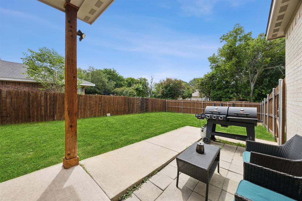 1122 Alicia Lane Lancaster, TX 75134 - Photo 23 of 37 a view of a bench in the garden