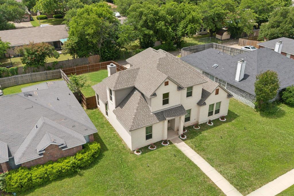 1122 Alicia Lane Lancaster, TX 75134 - Photo 28 of 37 an aerial view of a house with a yard