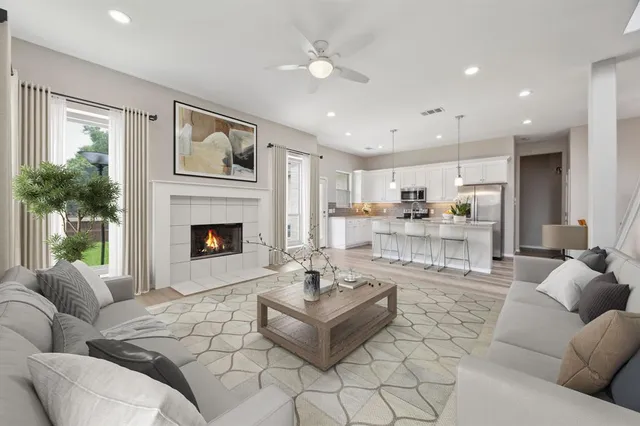 a living room with furniture and a fireplace
