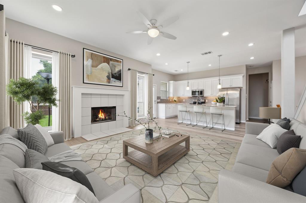 1122 Alicia Lane Lancaster, TX 75134 - Photo 4 of 37 a living room with furniture and a fireplace