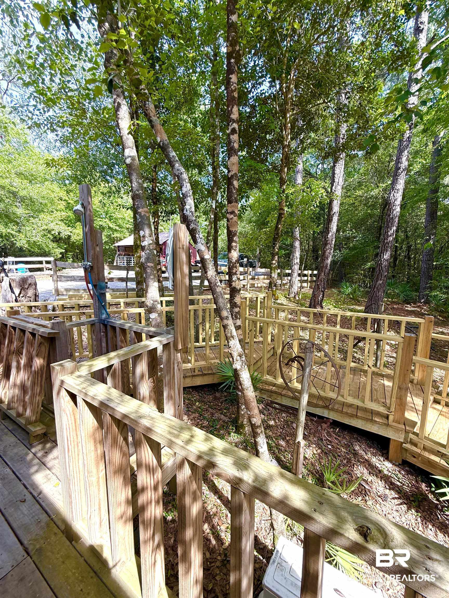 1 Mason Ferry Road Citronelle, AL 36522 - Photo 4 of 40 Outdoor shower station featuring a wood privacy screen and exposed plumbing