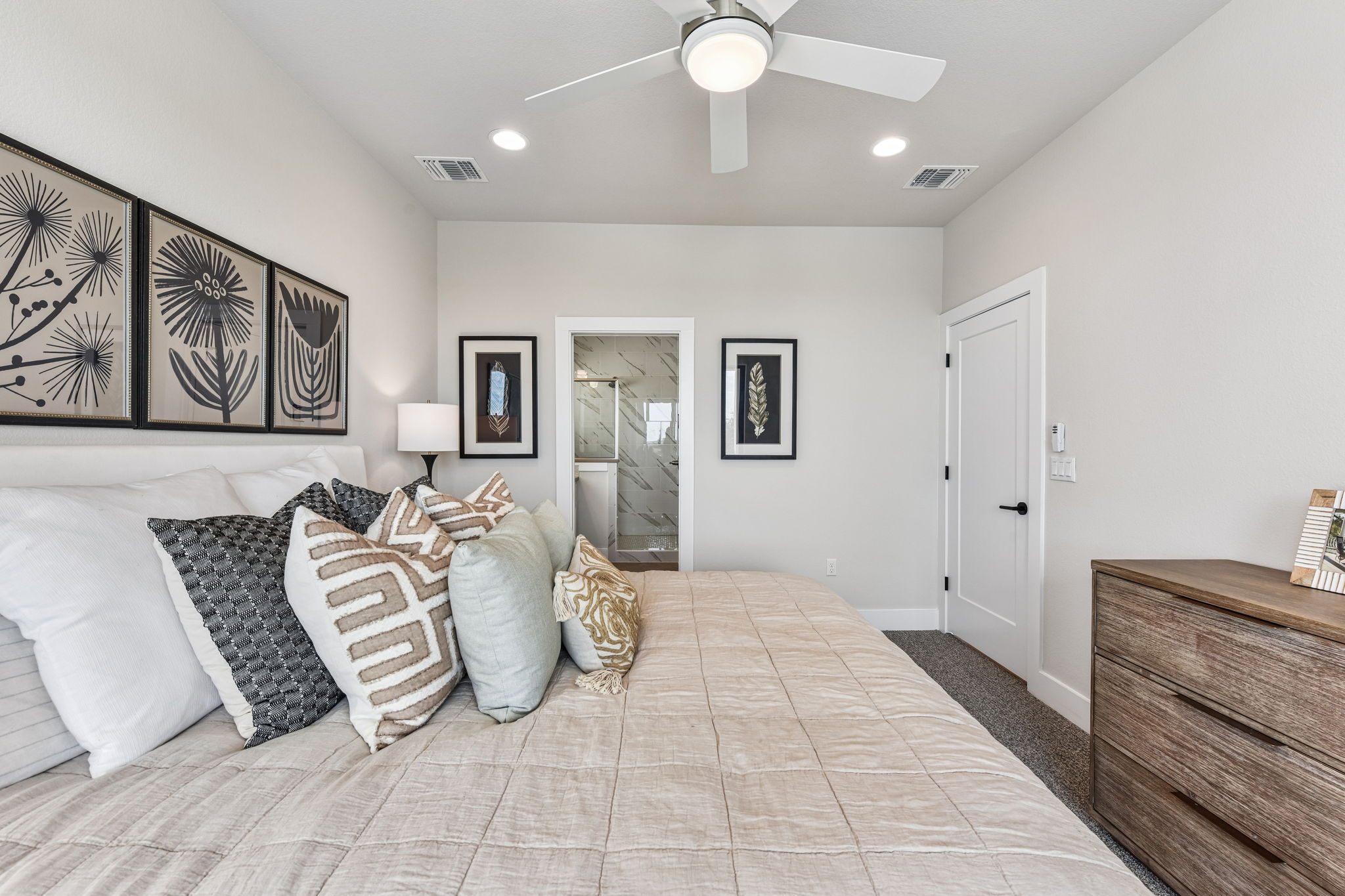 9101 Cattle Baron Path Austin, TX 78747 - Photo 23 of 40 Comfortable bedroom retreat with a dedicated bathroom, perfect for unwinding after a long day.