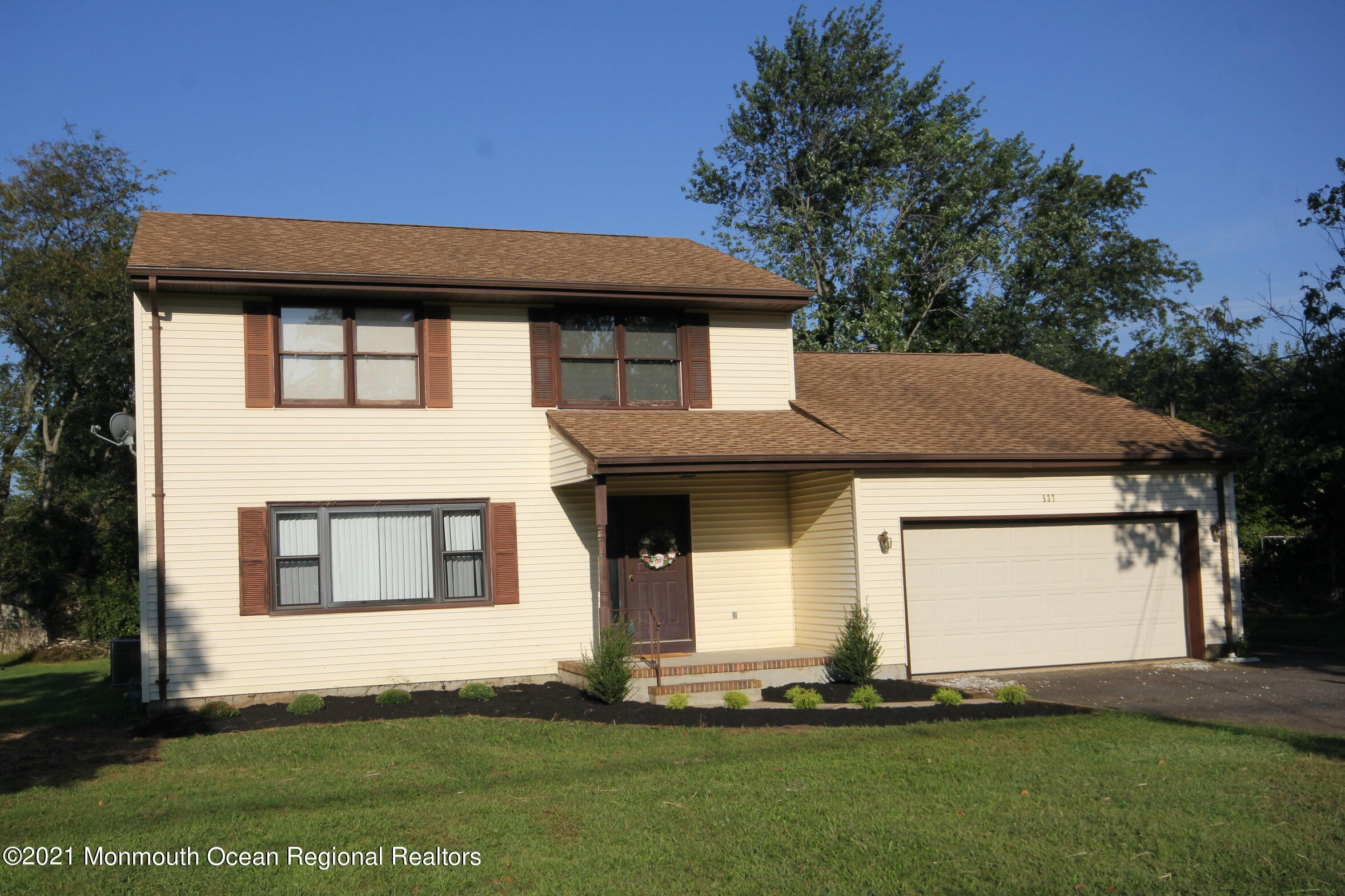 537 Line Road Aberdeen, NJ 07747 - Photo 1 of 23 a front view of a house with a yard