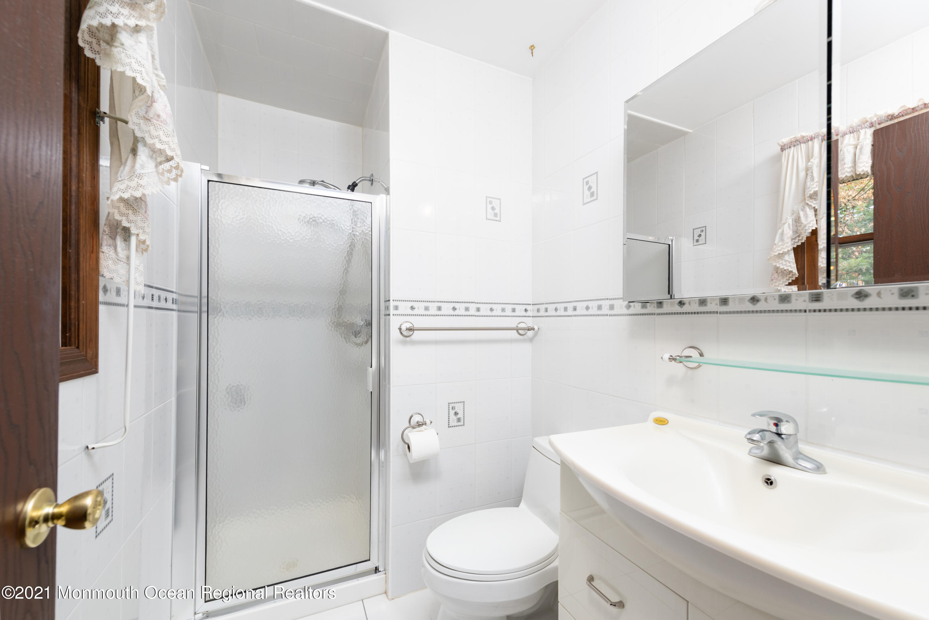 537 Line Road Aberdeen, NJ 07747 - Photo 18 of 23 a bathroom with a sink a toilet and shower