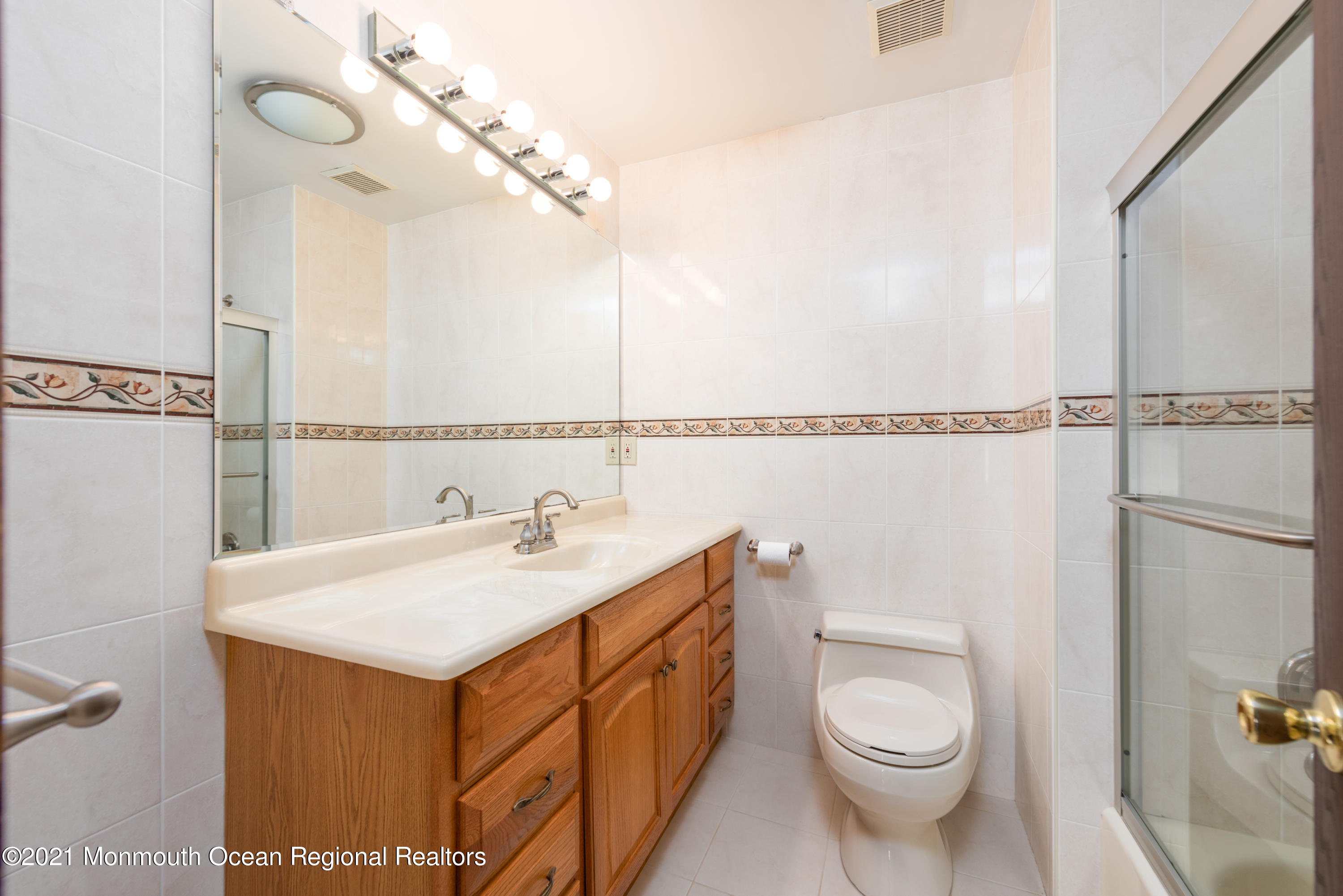 537 Line Road Aberdeen, NJ 07747 - Photo 23 of 23 a bathroom with a sink a toilet and shower