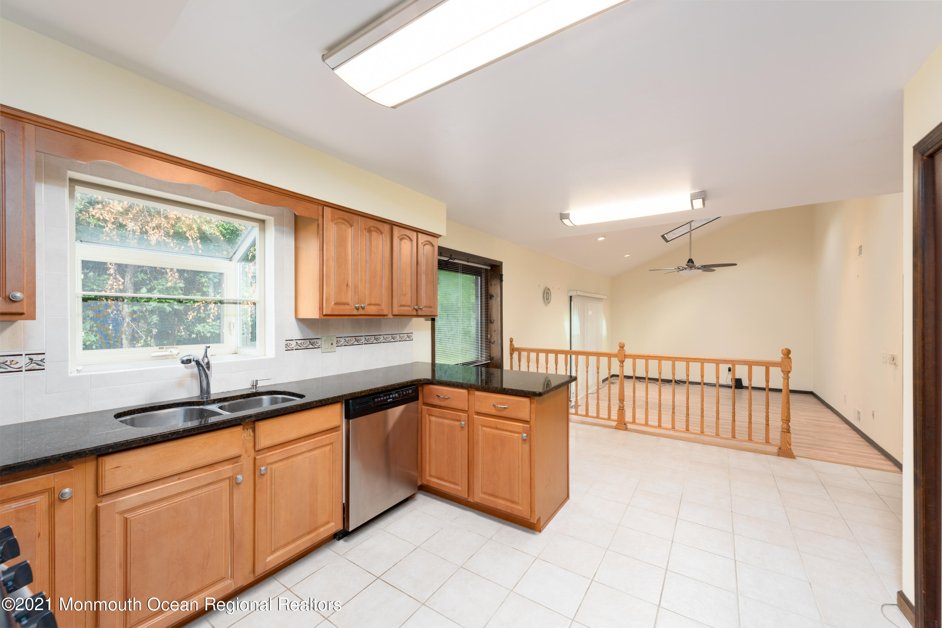 537 Line Road Aberdeen, NJ 07747 - Photo 10 of 23 a kitchen with stainless steel appliances granite countertop a sink and cabinets with wooden floor