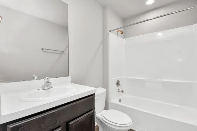 a bathroom with a sink a toilet and a bathtub