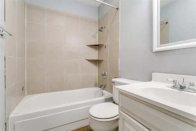a bathroom with a sink toilet and bathtub