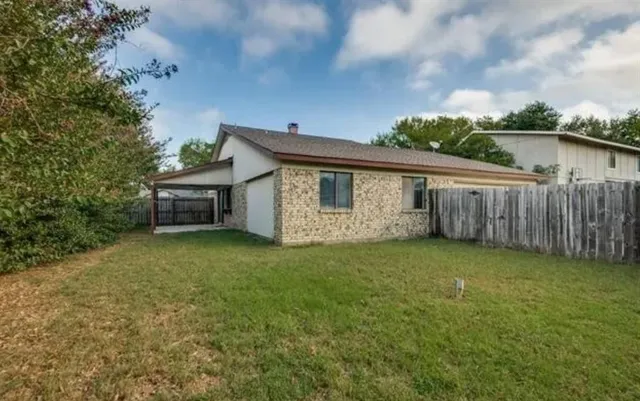 a backyard of a house with lots of green space