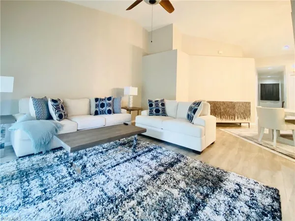 a living room with a couch and a flat screen tv