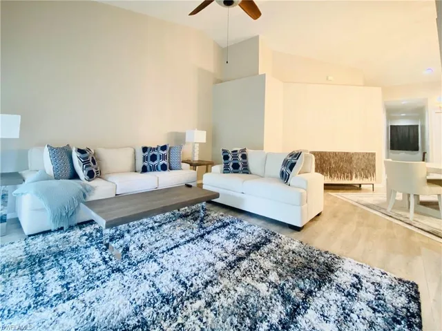 a living room with a couch and a flat screen tv