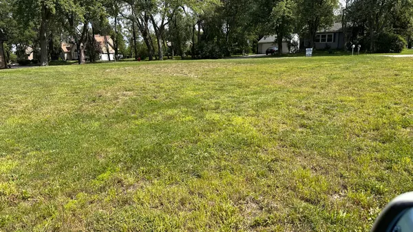 a view of a field with trees