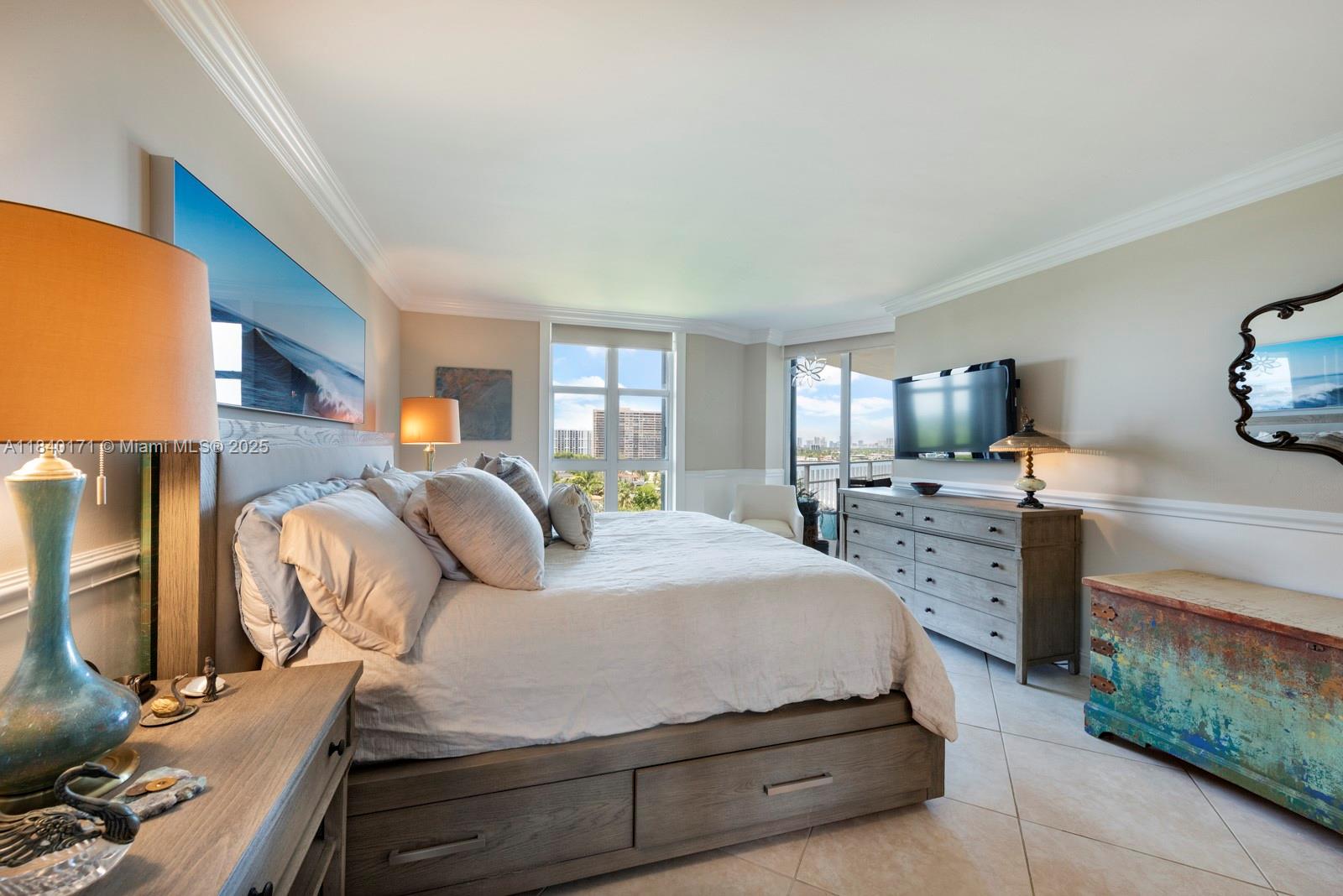 4000 Towerside Terrace, Unit 1005 Miami, FL 33138 - Photo 18 of 25 a spacious bedroom with a bed and wooden floor