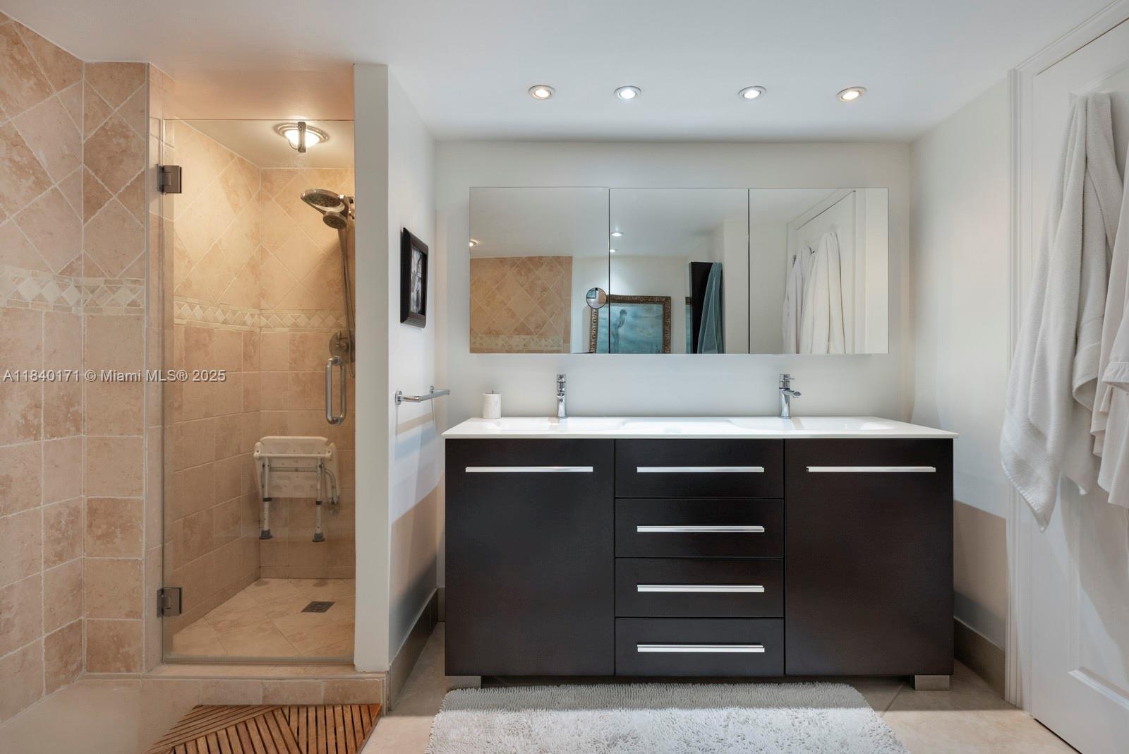 4000 Towerside Terrace, Unit 1005 Miami, FL 33138 - Photo 19 of 25 a bathroom with a sink a toilet and shower