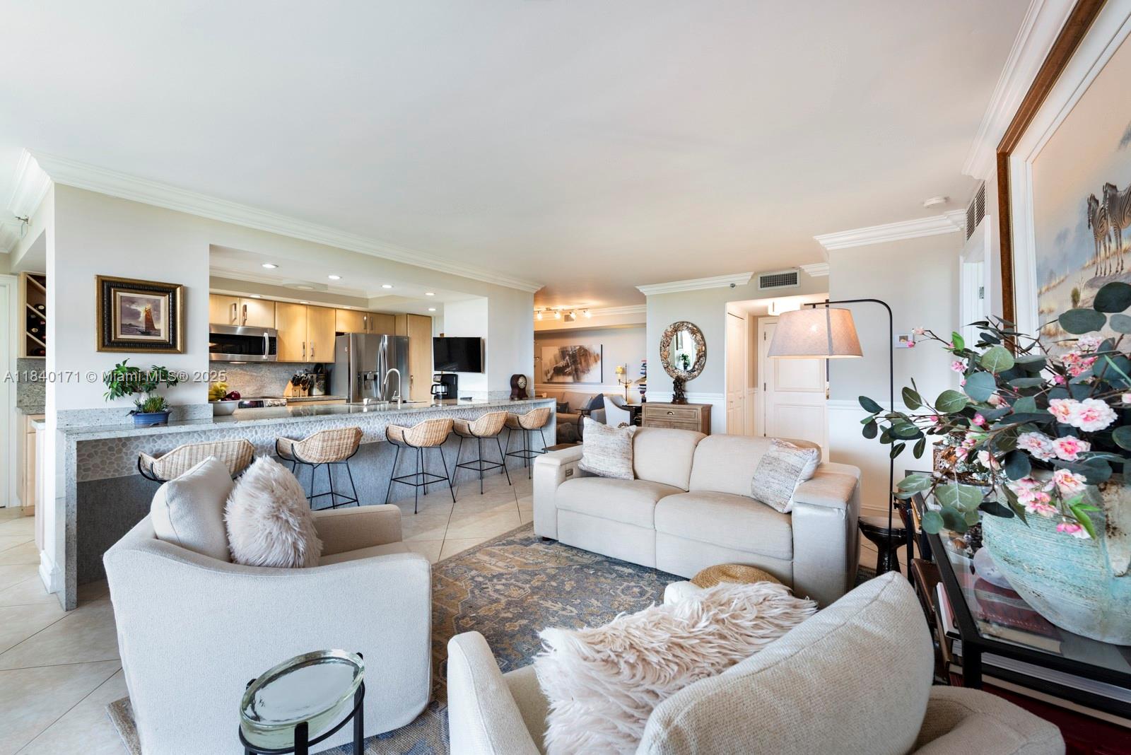 4000 Towerside Terrace, Unit 1005 Miami, FL 33138 - Photo 21 of 25 a living room with furniture potted plant and a large window