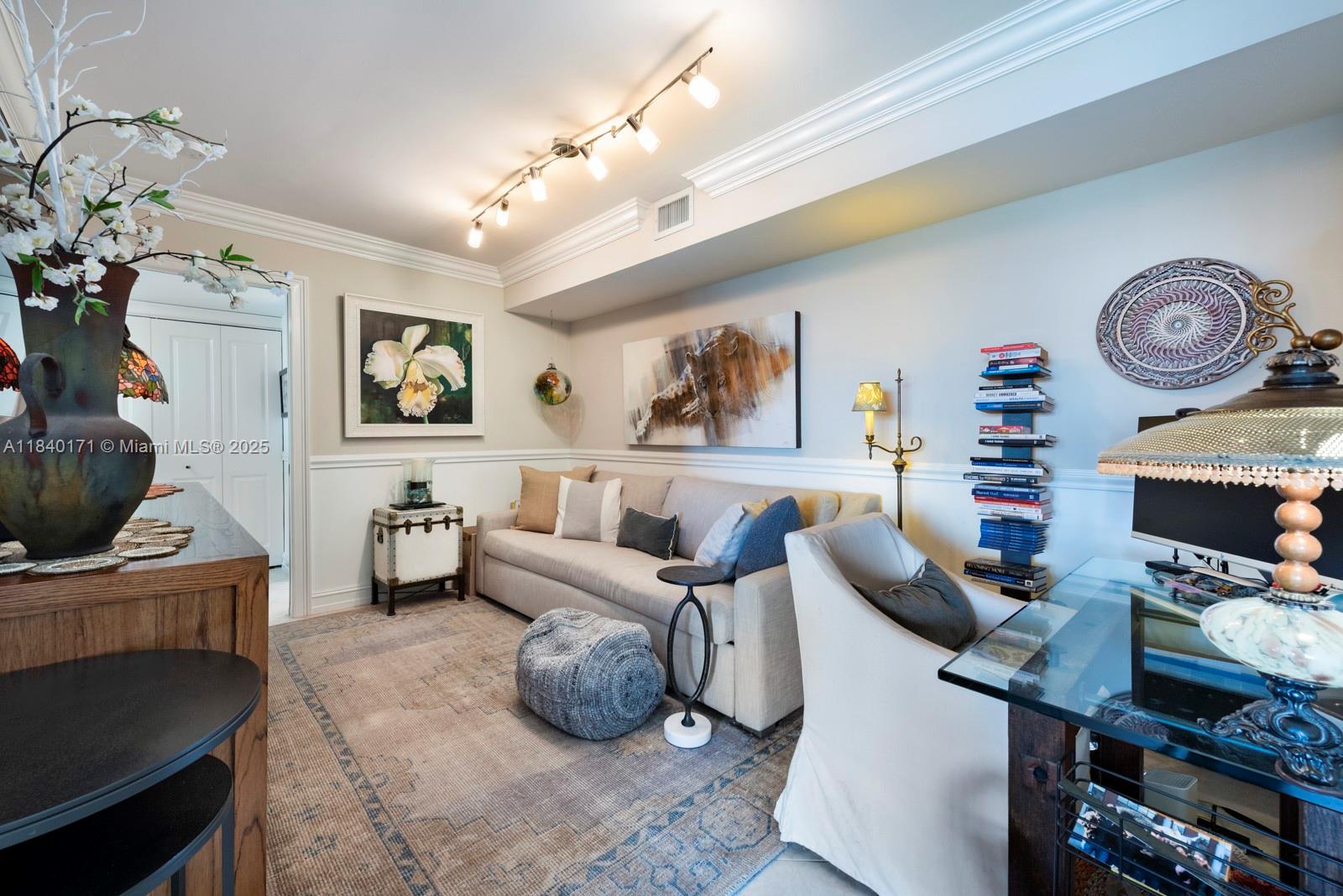 4000 Towerside Terrace, Unit 1005 Miami, FL 33138 - Photo 7 of 25 a living room with furniture and a flat screen tv