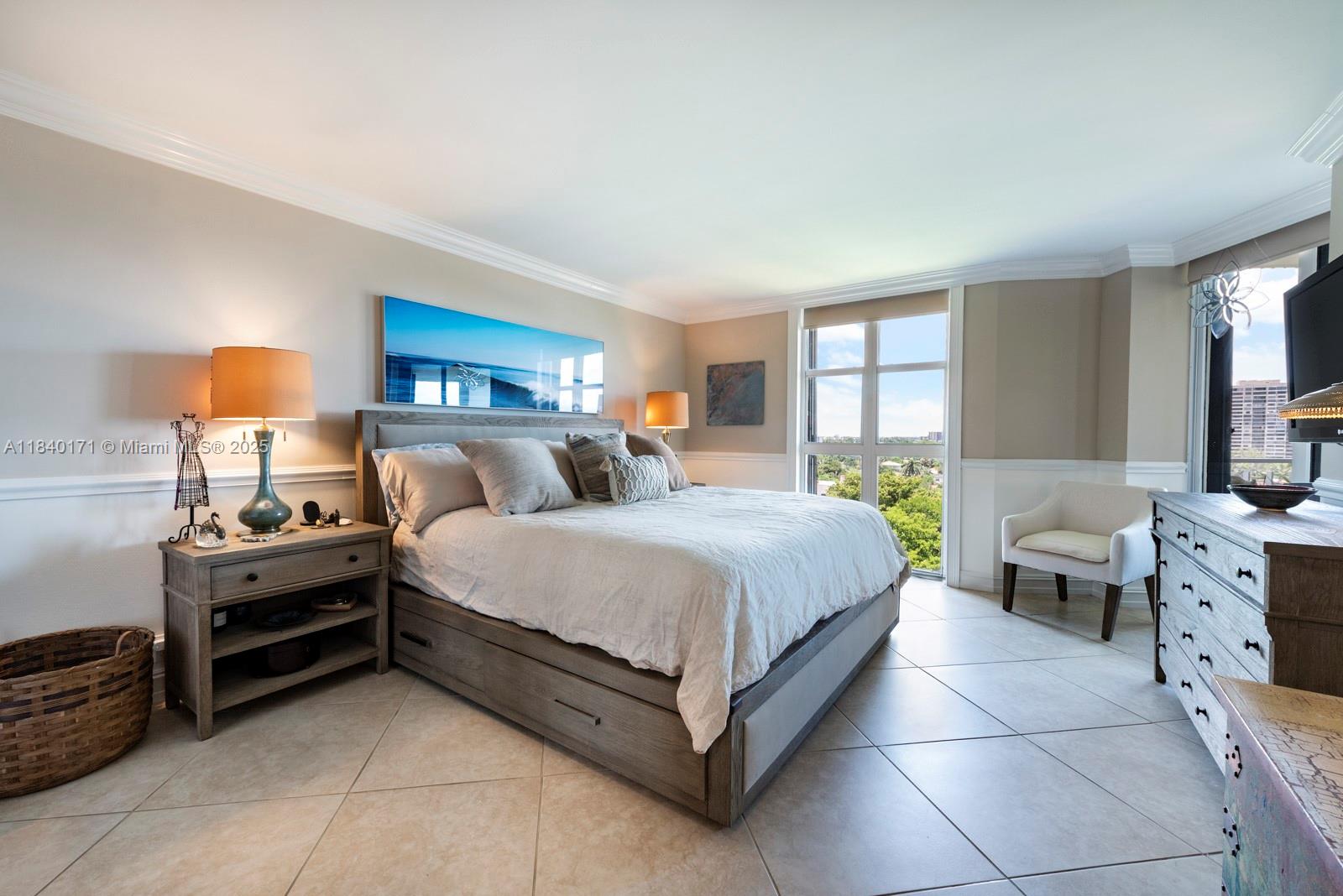 4000 Towerside Terrace, Unit 1005 Miami, FL 33138 - Photo 8 of 25 a bedroom with a bed and a dresser next to a window