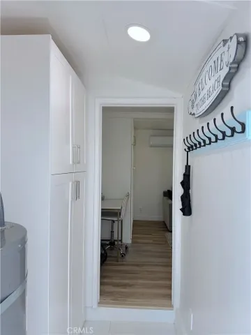 a view of an entryway with wooden floor