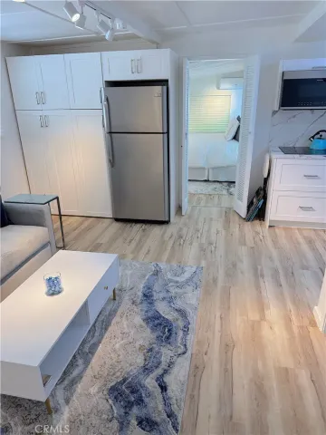 a kitchen with a sink and a refrigerator