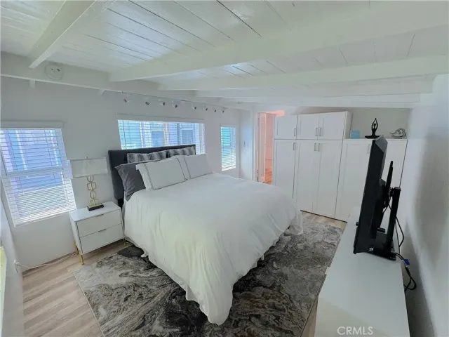 a bed room with a bed and a window