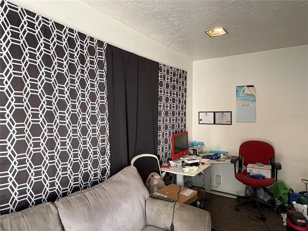 a room with furniture and musical instruments