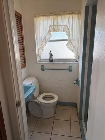 a room with water heater and wooden floor