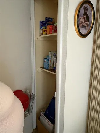 a living room with furniture and a lamp