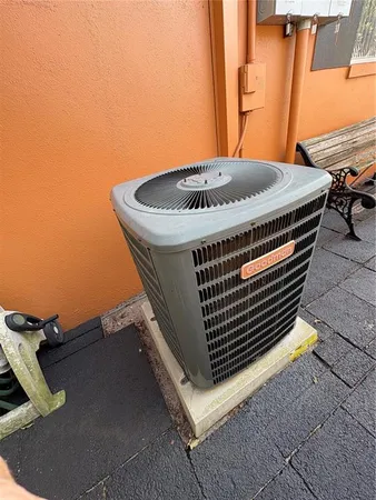 a backyard of a house with outdoor seating