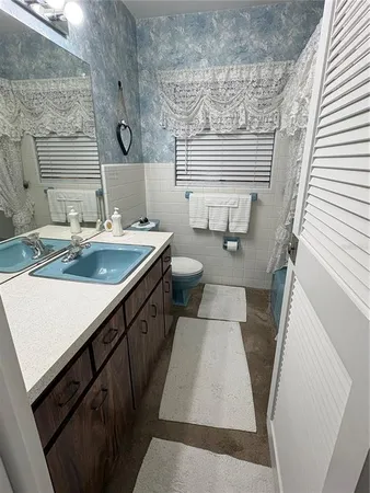 a bedroom with bed and a window