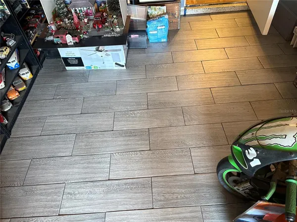 a bedroom with two beds and a chandelier