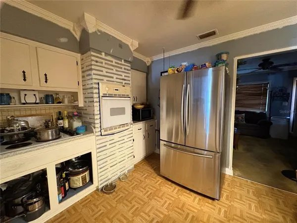 a view of walk in closet with clothes