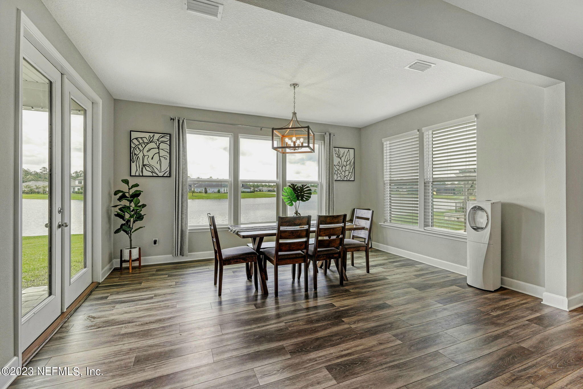 69 Willow Lake Drive St. Augustine, FL 32092 - Photo 13 of 42 a view of a dining room with furniture window and wooden floor