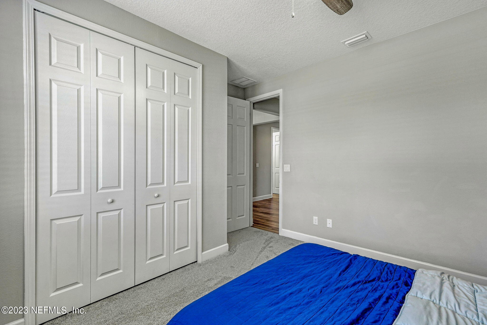 69 Willow Lake Drive St. Augustine, FL 32092 - Photo 23 of 42 an empty room with wooden floor and closet area