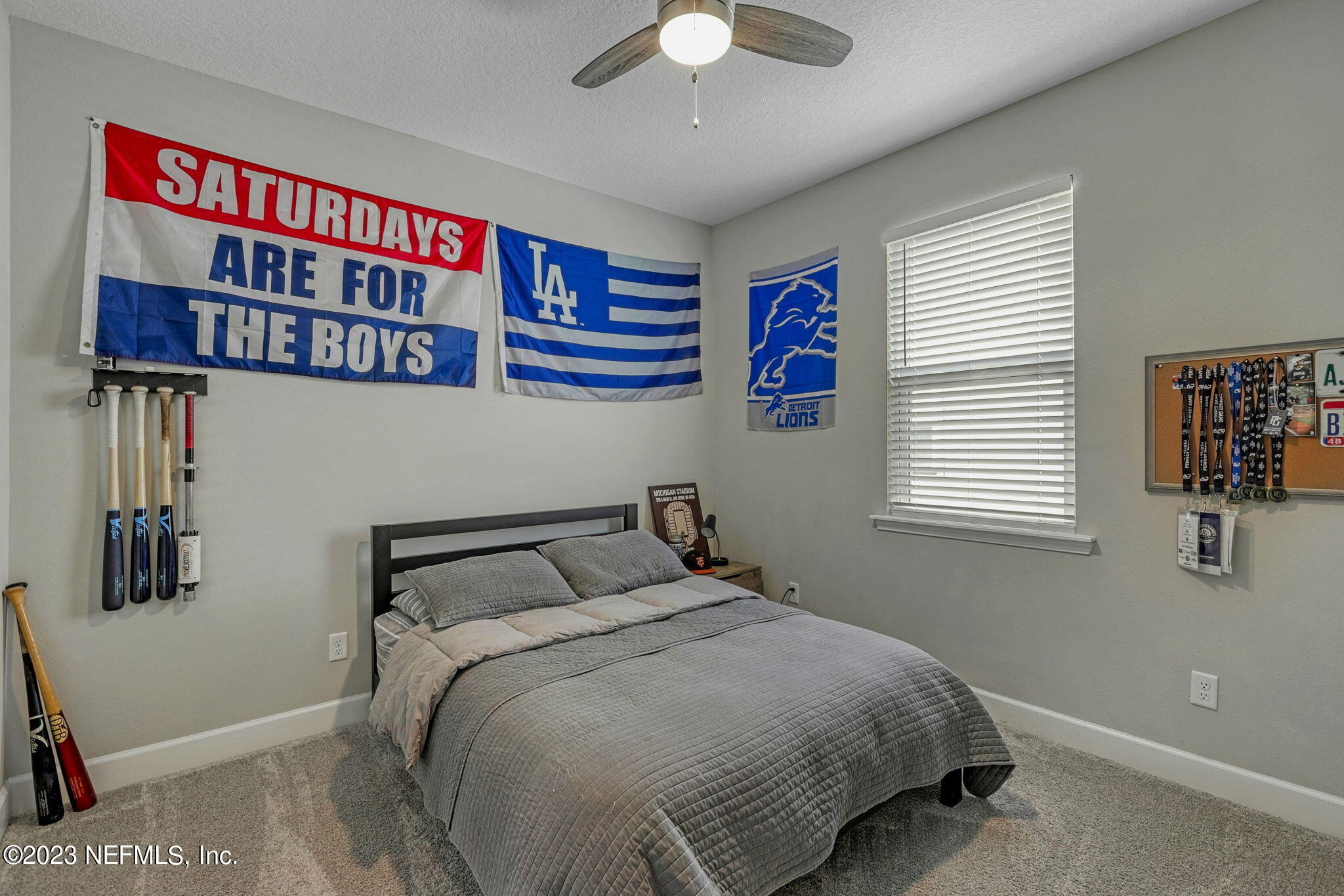 69 Willow Lake Drive St. Augustine, FL 32092 - Photo 25 of 42 a bedroom with a bed and a book shelf