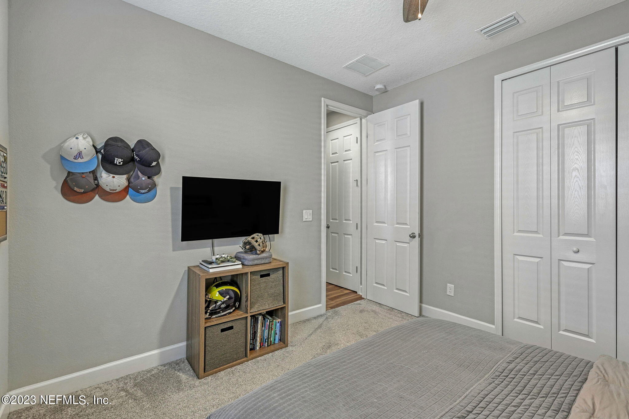 69 Willow Lake Drive St. Augustine, FL 32092 - Photo 26 of 42 a living room with furniture and a flat screen tv