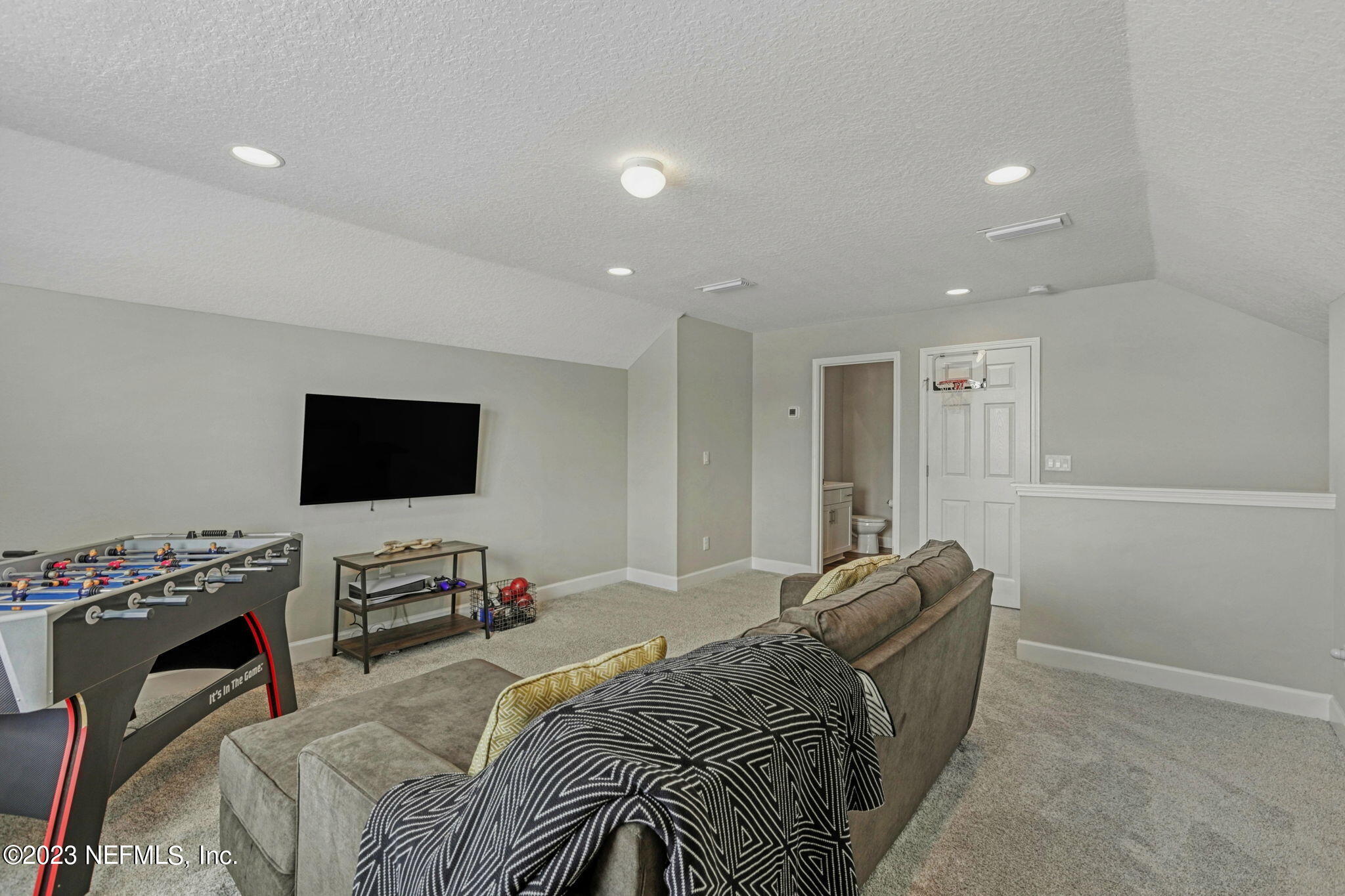 69 Willow Lake Drive St. Augustine, FL 32092 - Photo 30 of 42 a bed room with a bed a television and a couch