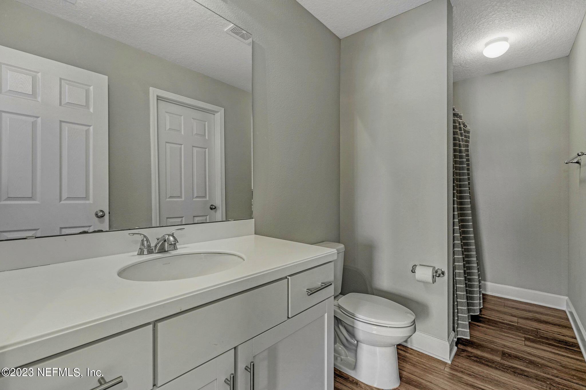 69 Willow Lake Drive St. Augustine, FL 32092 - Photo 31 of 42 a bathroom with a sink toilet and a mirror