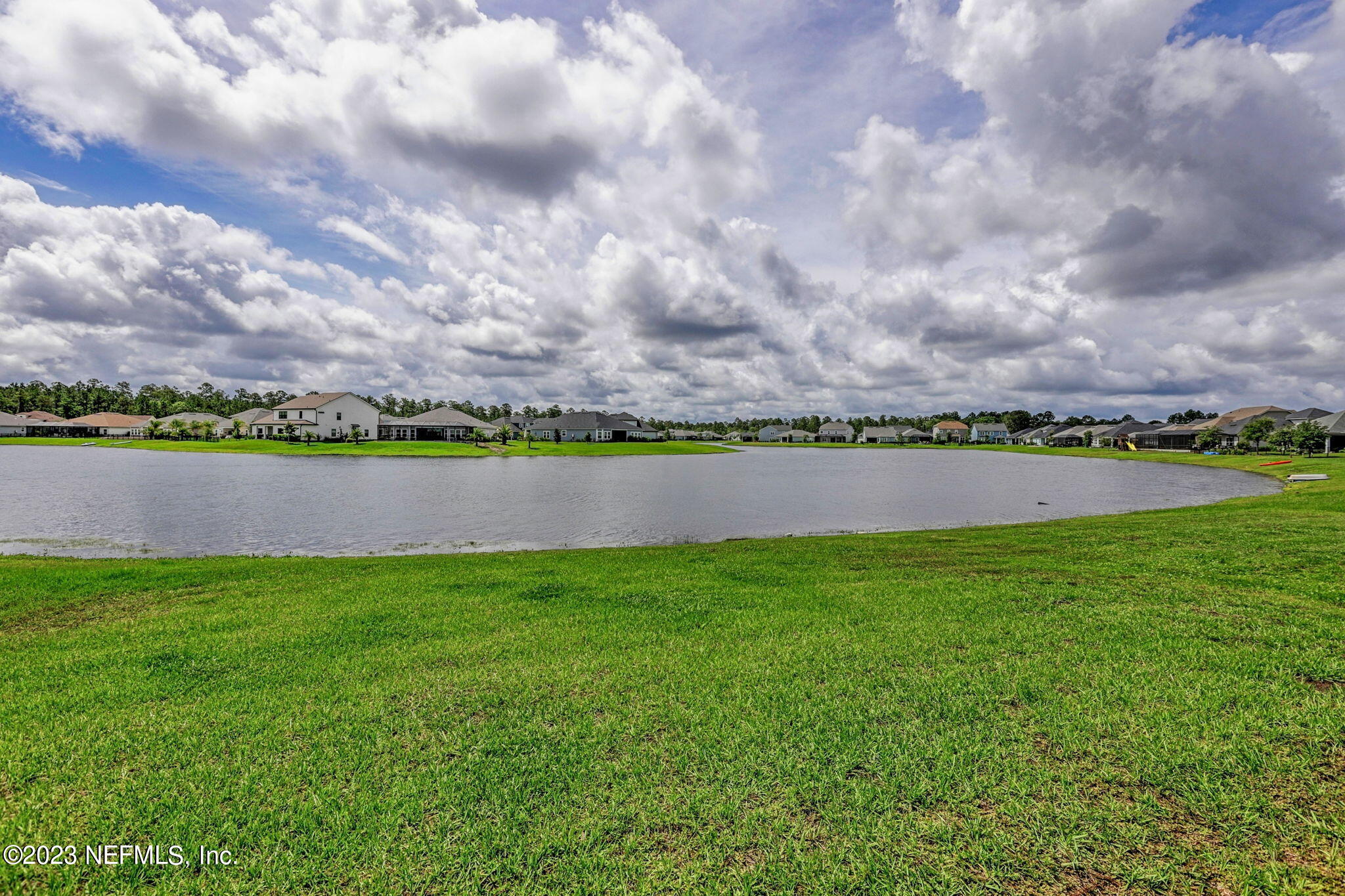 69 Willow Lake Drive St. Augustine, FL 32092 - Photo 32 of 42 a view of a lake with a big yard
