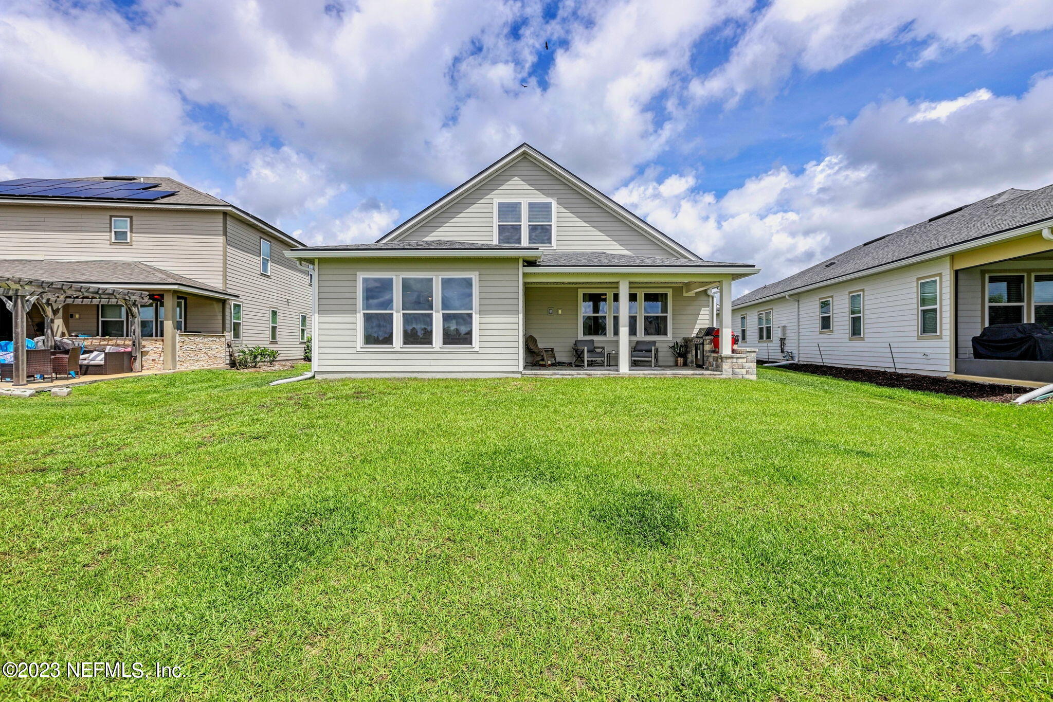 69 Willow Lake Drive St. Augustine, FL 32092 - Photo 34 of 42 a view of a house with a big yard and large trees