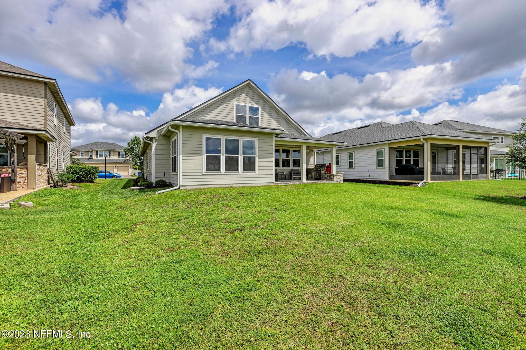 69 Willow Lake Drive St. Augustine, FL 32092 - Photo 35 of 42 a view of a house with a big yard and large trees