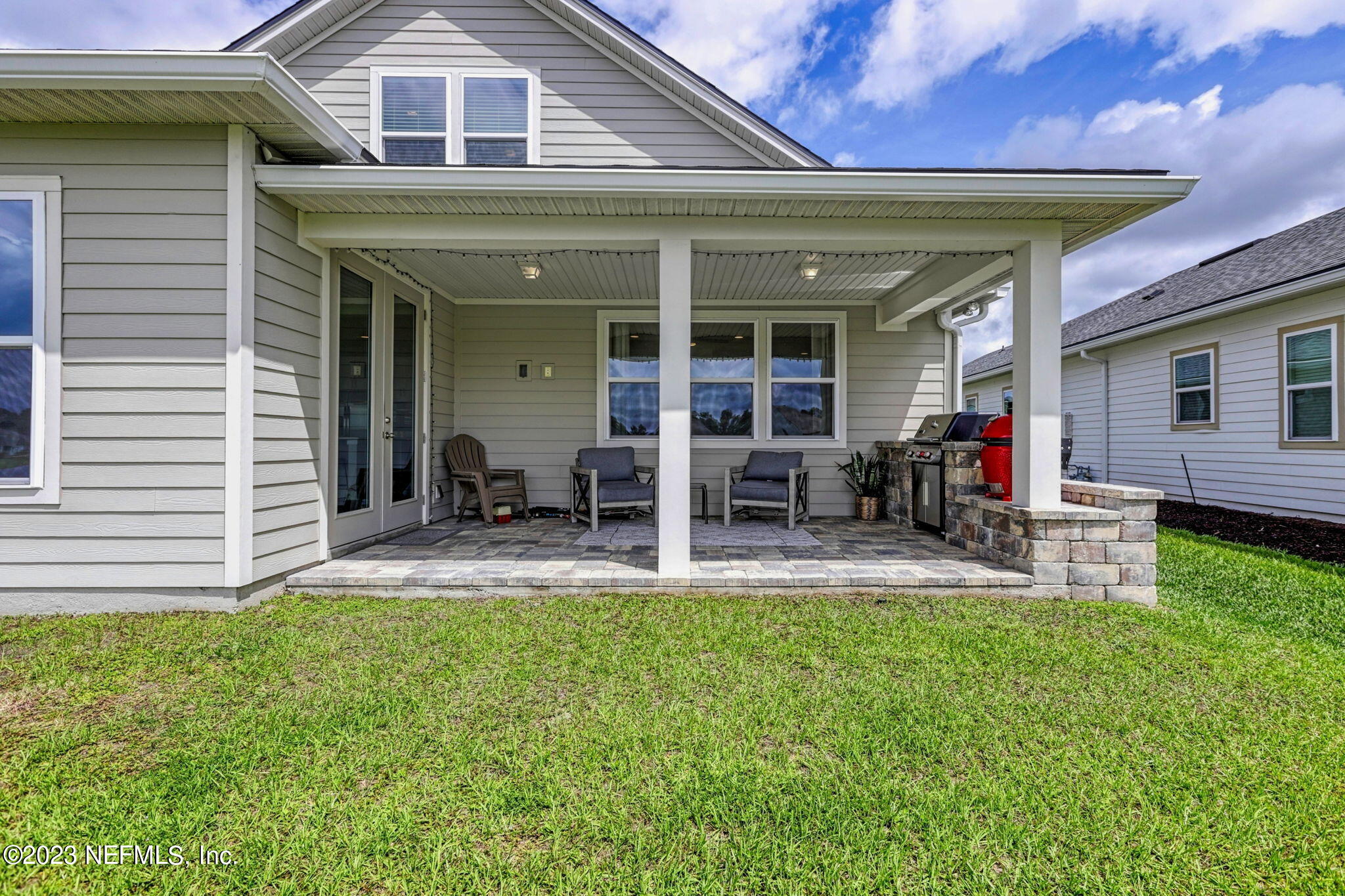 69 Willow Lake Drive St. Augustine, FL 32092 - Photo 36 of 42 a view of a house with a patio and a yard