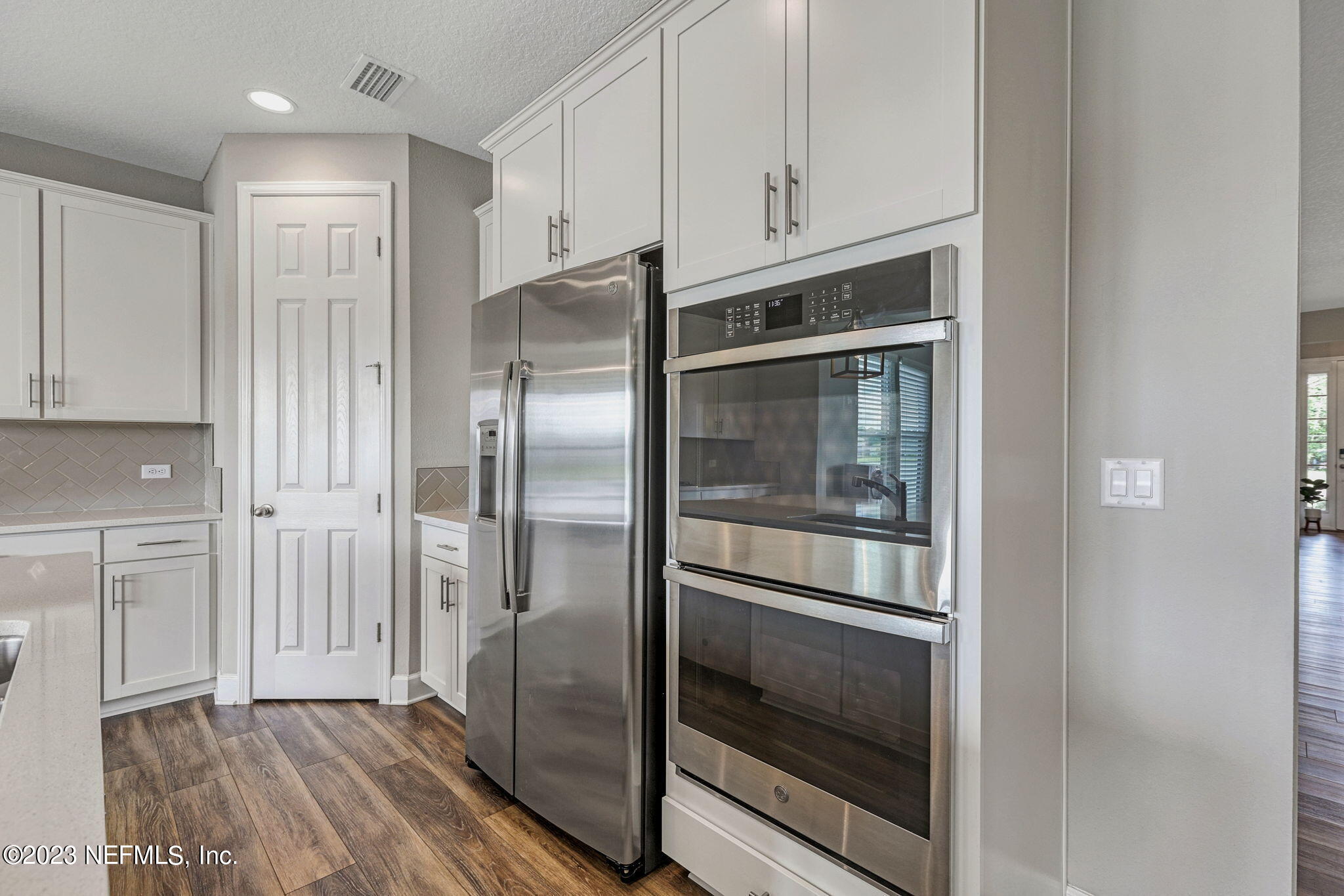 69 Willow Lake Drive St. Augustine, FL 32092 - Photo 8 of 42 a kitchen with cabinets and stainless steel appliances